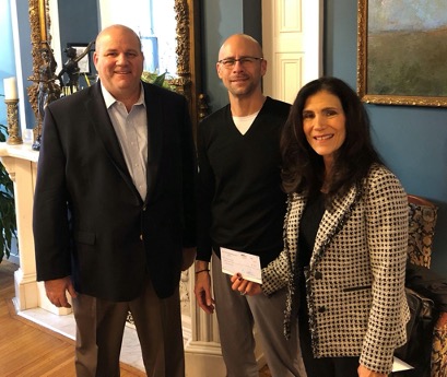 Eisenberg, Rothweiler, Winkler, Eisenberg & Jeck, P.C., shareholders Daniel Jeck (left) and Nancy Winkler (right) present a donation from the law firm to Paul Geller (center), regional Executive Director of the Crohn's & Colitis Foundation.