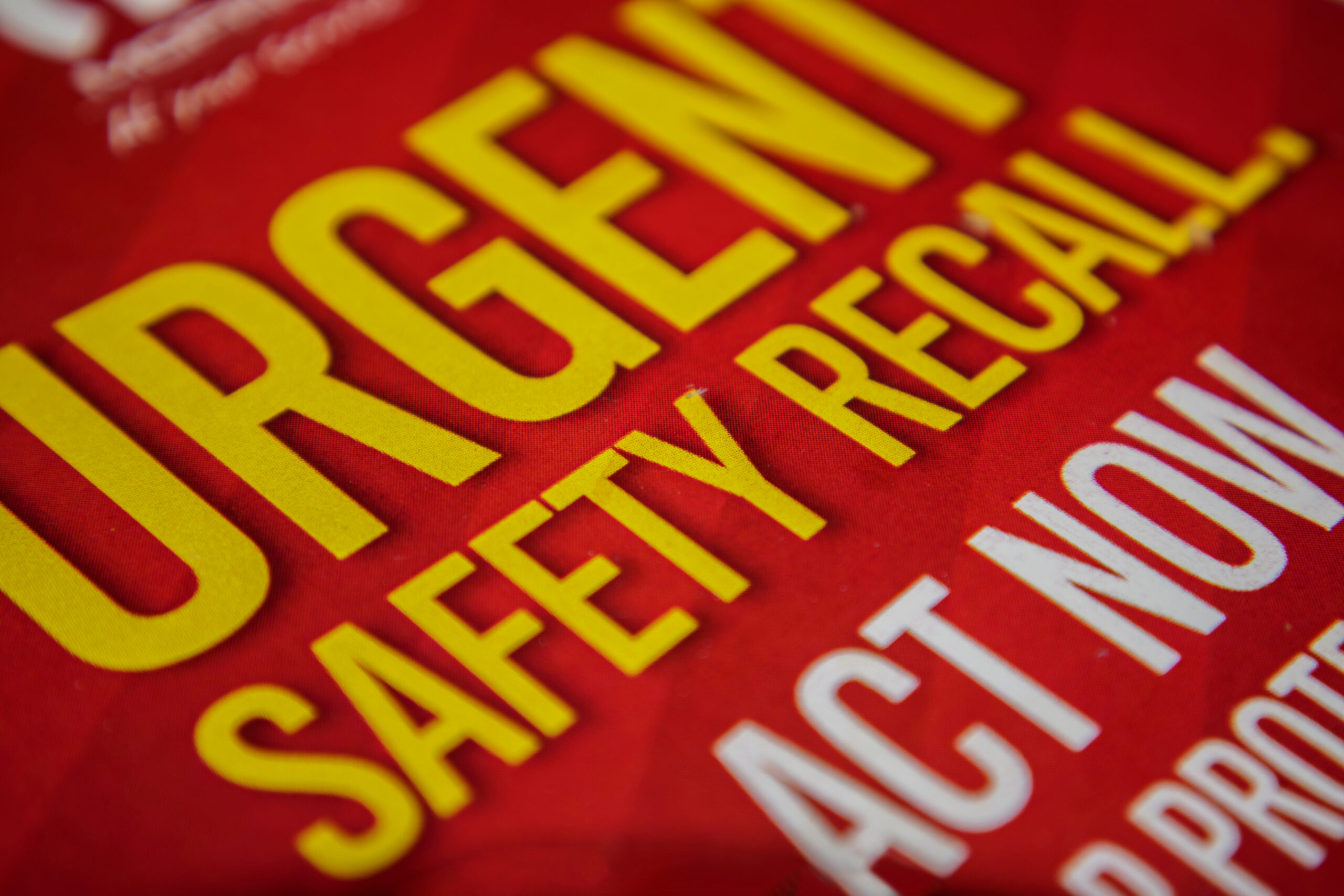 generic urgent safety recall graphic: red and yellow